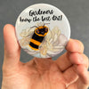 Funny gardener magnet held in hand to show 2.25-inch size and glossy finish