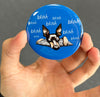 Funny Miniature Pinscher magnet held between fingers to show 2.25-inch size