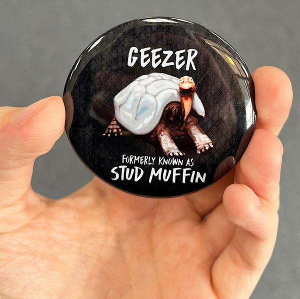 Funny tortoise magnet held in hand to show 2.25-inch size and glossy finish