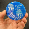Inspirational jellyfish magnet held in hand to show 2.25-inch size and glossy finish