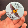 Oregon meadowlark magnet held in hand to show 2.25-inch size and glossy finish