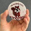 Funny squirrel magnet held in hand to show 2.25-inch size and glossy finish