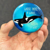 Inspirational orca magnet held in hand to show 2.25-inch size and glossy finish