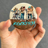 Funny rockfish magnet held in hand to show 2.25-inch size and glossy finish