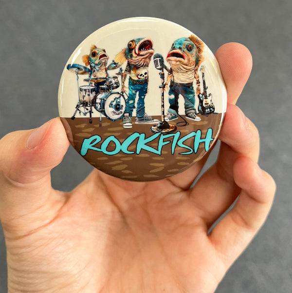Funny rockfish magnet held in hand to show 2.25-inch size and glossy finish