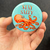 Funny octopus magnet held in hand to show 2.25-inch size and glossy finish