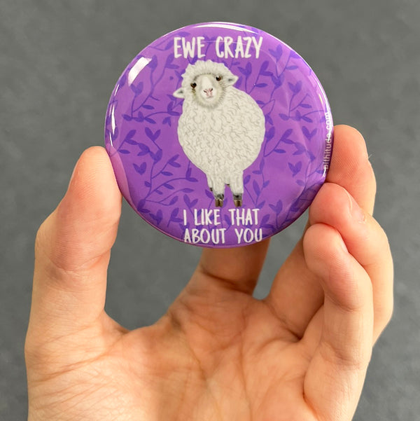 Funny sheep magnet held in hand to show 2.25-inch size and glossy finish