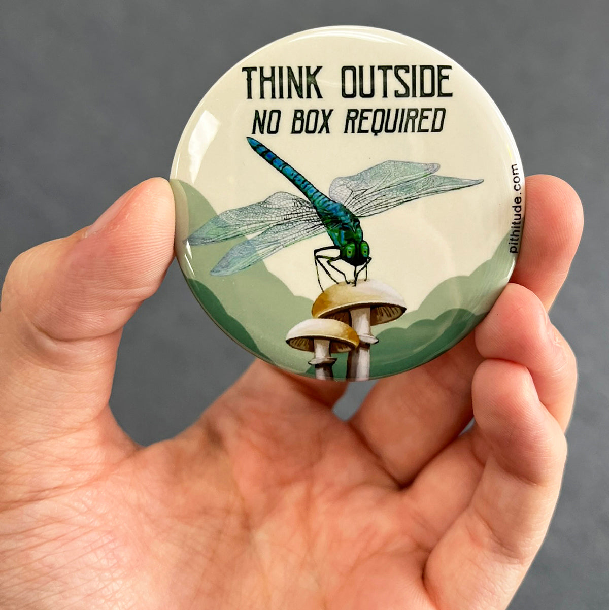 Nature lover magnet held in hand to show 2.25-inch size and glossy finish
