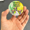 Funny Greyhound magnet held in hand to show 2.25-inch size and glossy finish