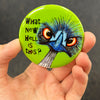 Funny emu magnet held in hand to show 2.25-inch size and glossy finish