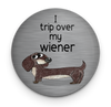 Funny dachshund magnet with I Trip Over My Wiener quote
